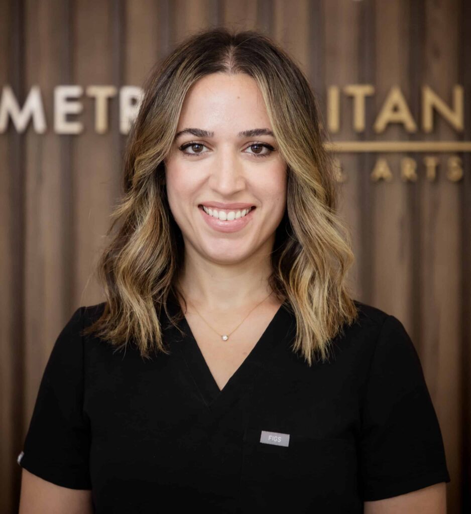 Dr. Bokhour, dentist at Brooklyn dental practice, smiles for professional headshot.