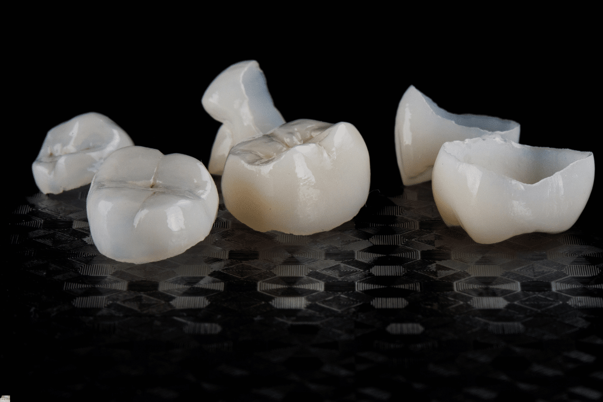 Ceramic dental crowns displayed showing various stages of same-day crown fabrication technology.