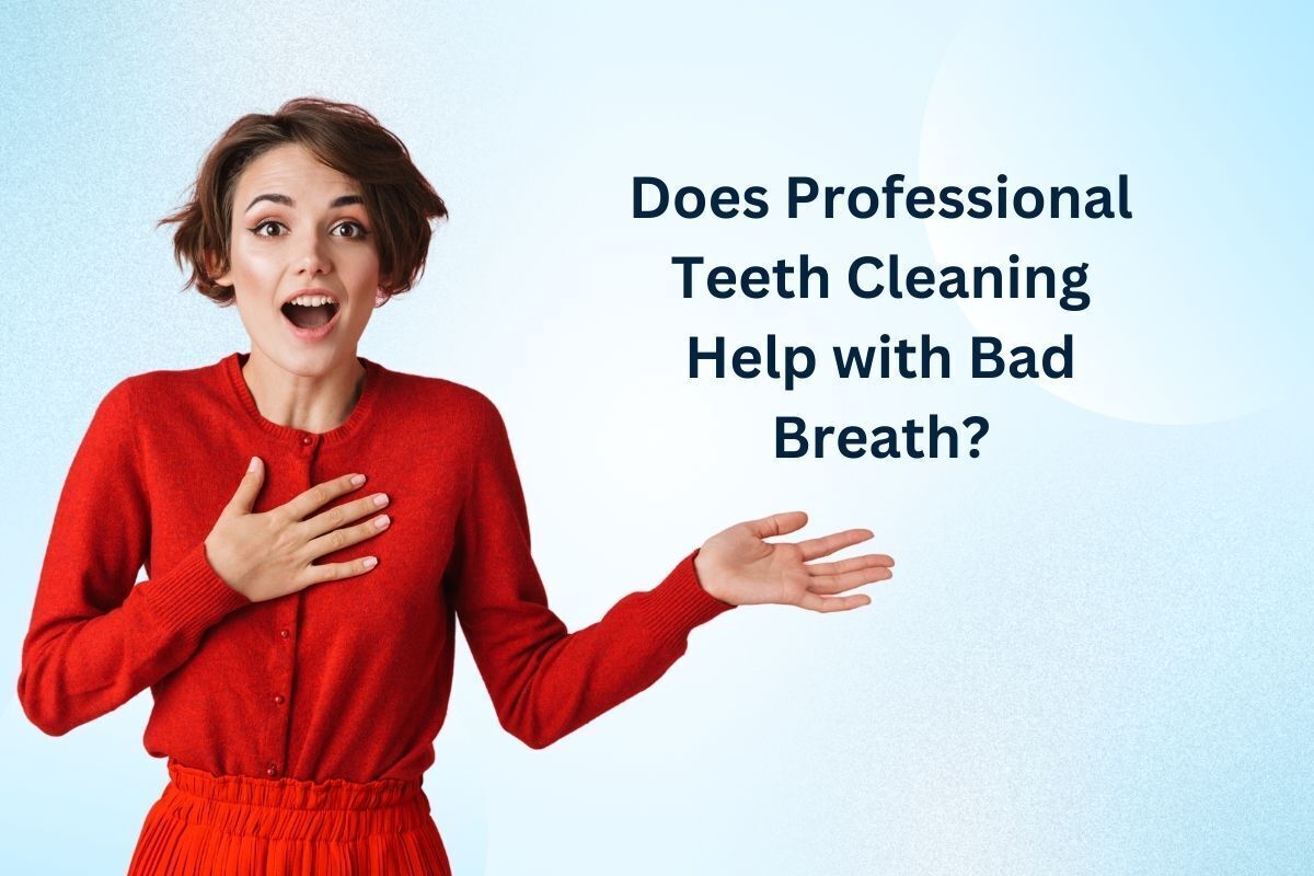 Woman in red asking about professional teeth cleaning and bad breath treatment at Brooklyn dental practice.
