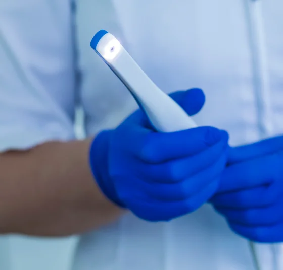 Dental professional using an intraoral scanner to capture digital impressions