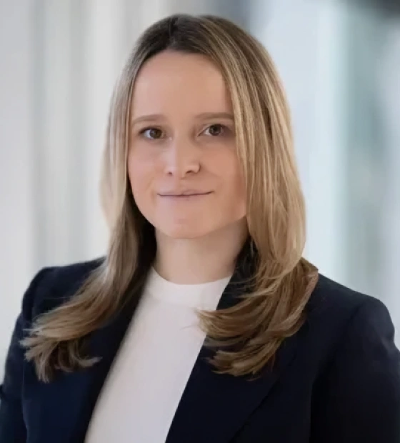 Professional headshot of a female dental professional wearing a black blazer