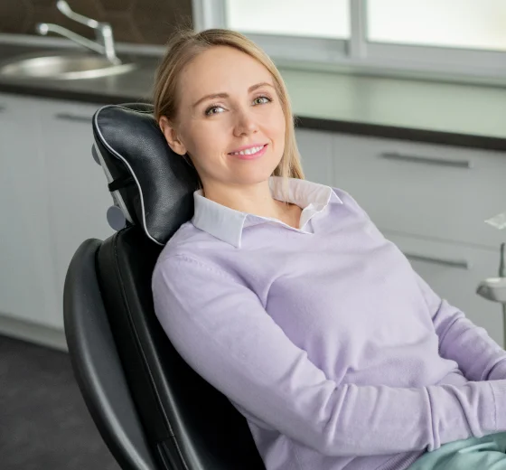 Woman reclining in a dental chair during a dental treatment