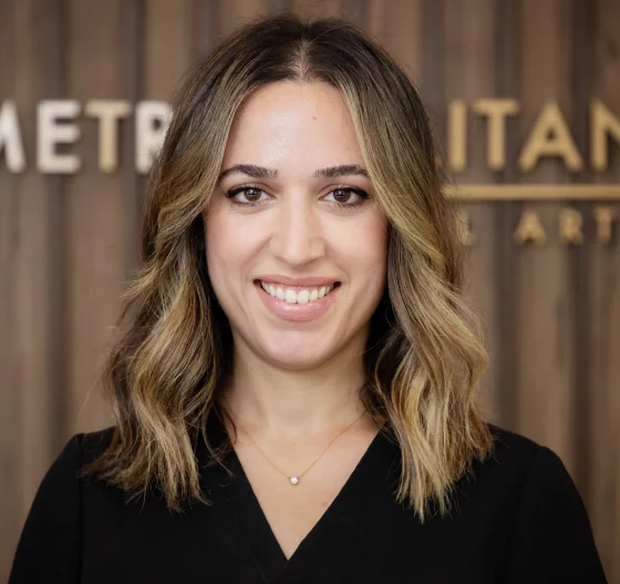 Professional headshot of a woman wearing a black top