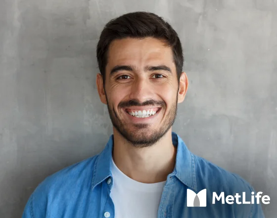 Man smiling with MetLife dental insurance branding