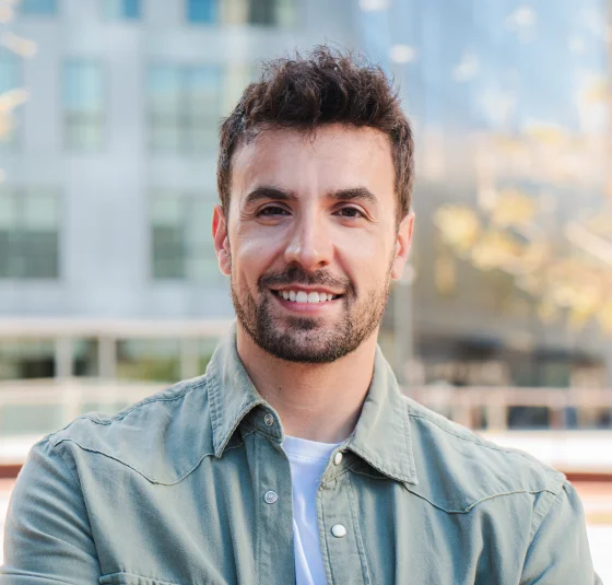 Smiling man wearing a light blue shirt