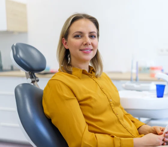 Woman sitting comfortably in a dental chair during an appointment