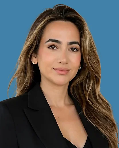 Professional headshot of a woman with long hair wearing a black top
